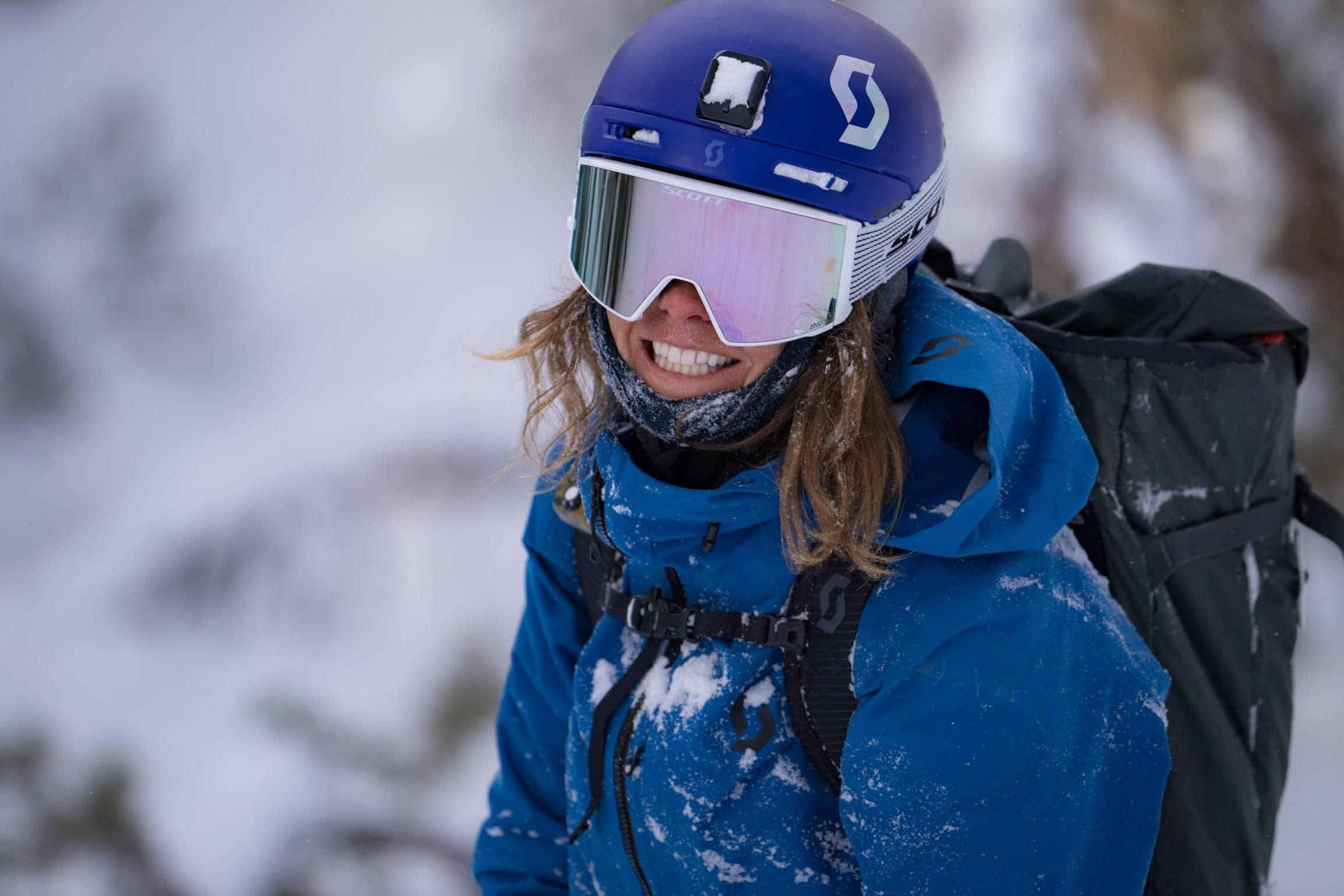 Molly Armanino smiles on a ski day wearing Ridge base layers