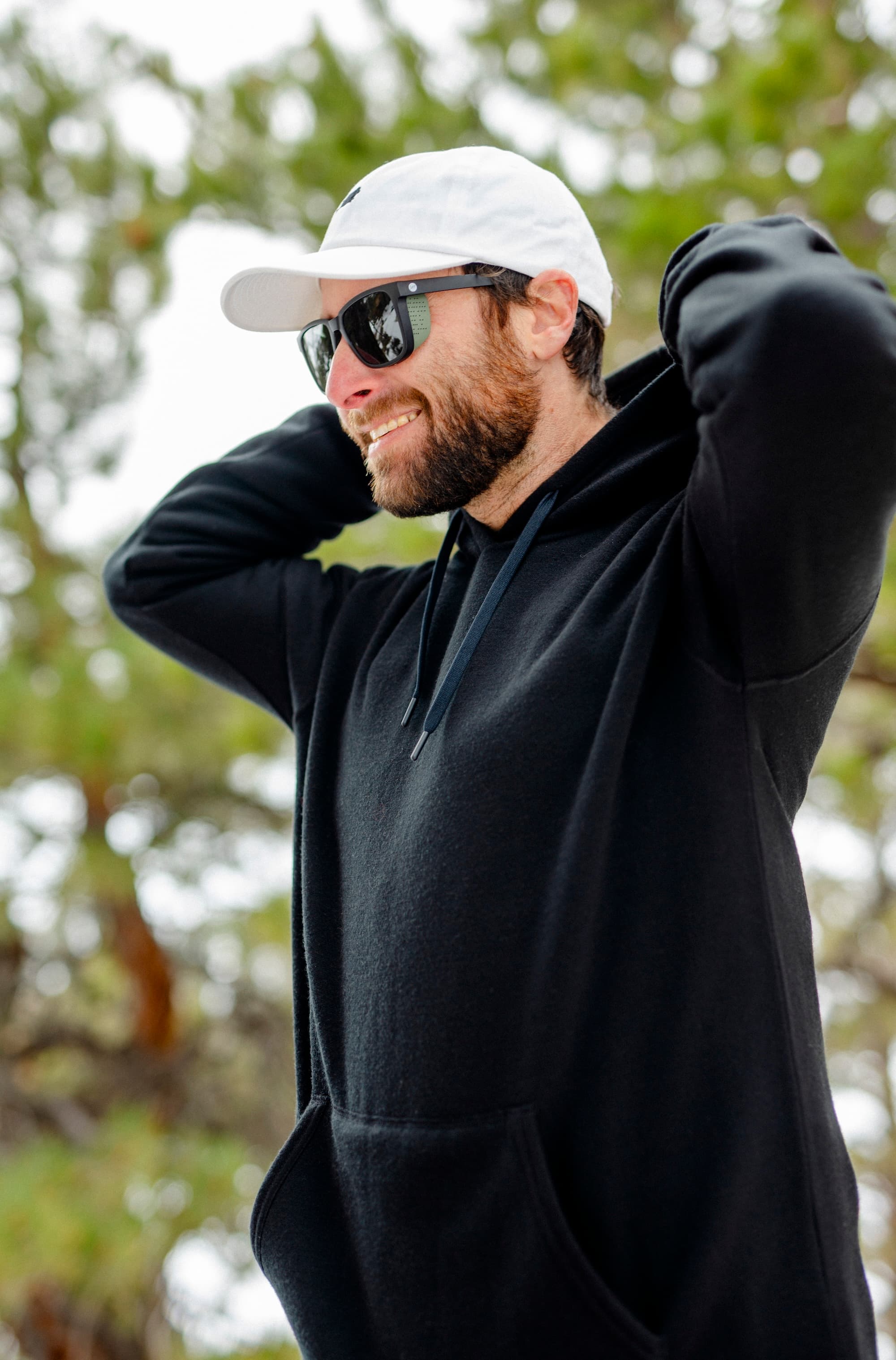 a man wearing a Ridge Onsen Merino Hoodie