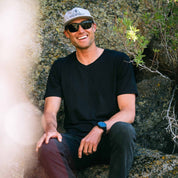 a man wearing a black Journey V-Neck Tee