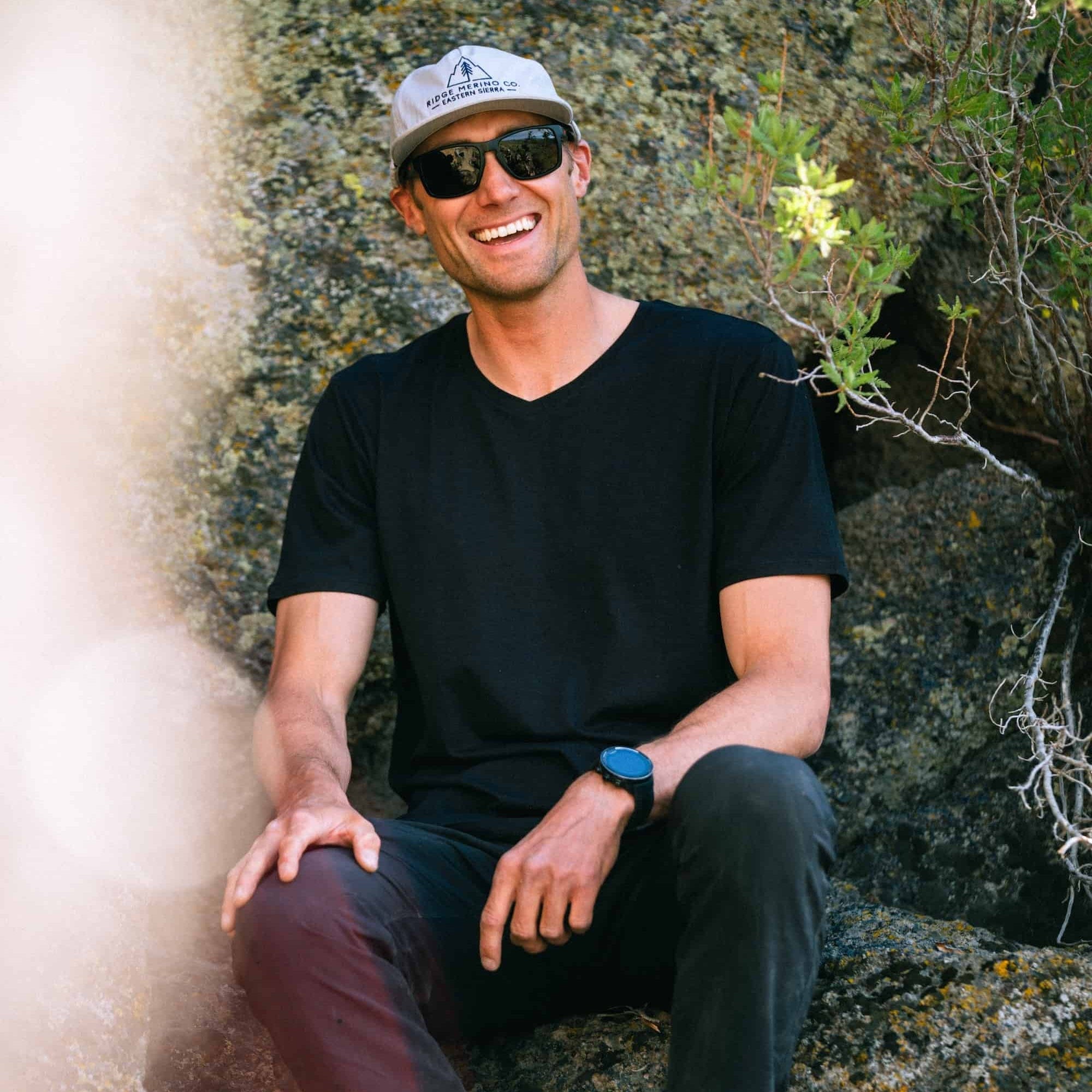 a man wearing a black Journey V-Neck Tee