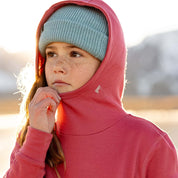 a girl wearing a Ridge Kids' Hyde Merino Hoodie