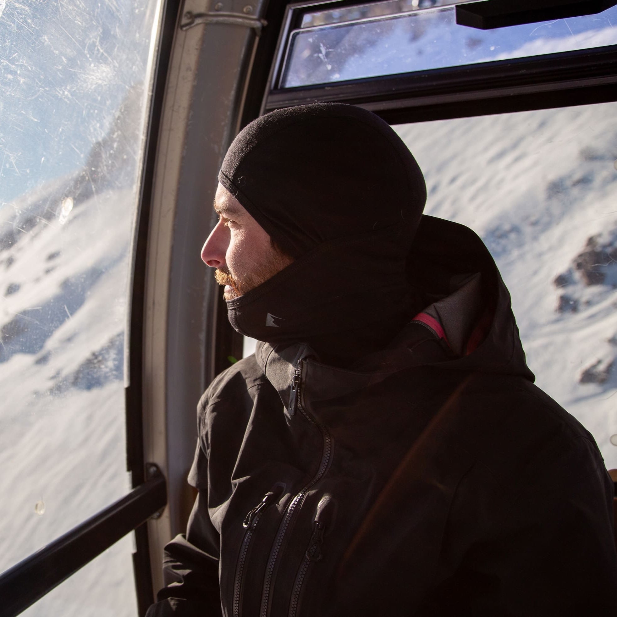 A skier wearing the Ridge Merino Wool Balaclava in a gondola