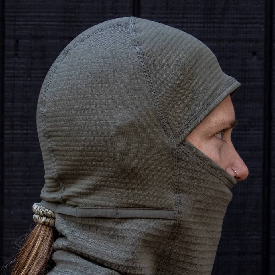 a woman wearing a Cloudripper grid fleece balaclava