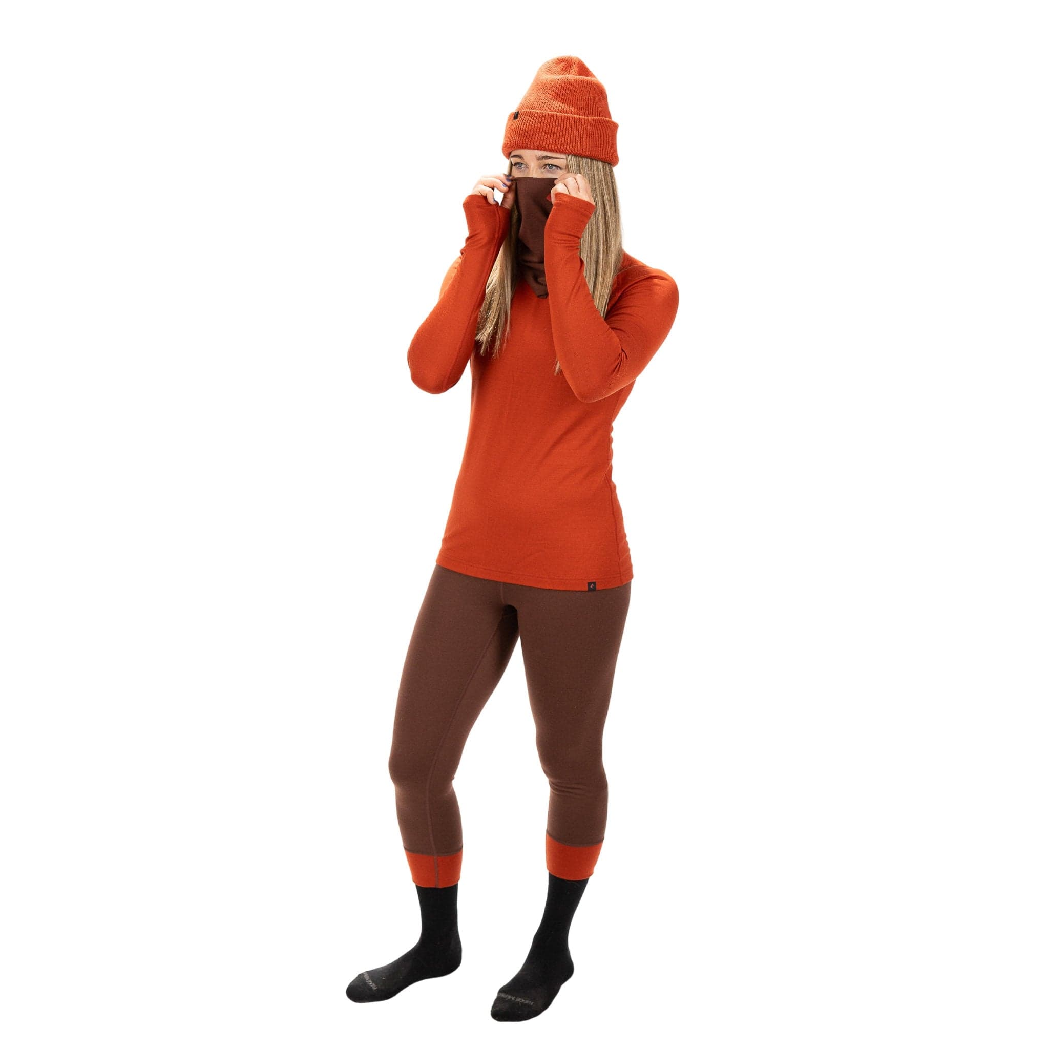 a model wearing a Ridge Merino neck gaiter and Ridge Merino base layers