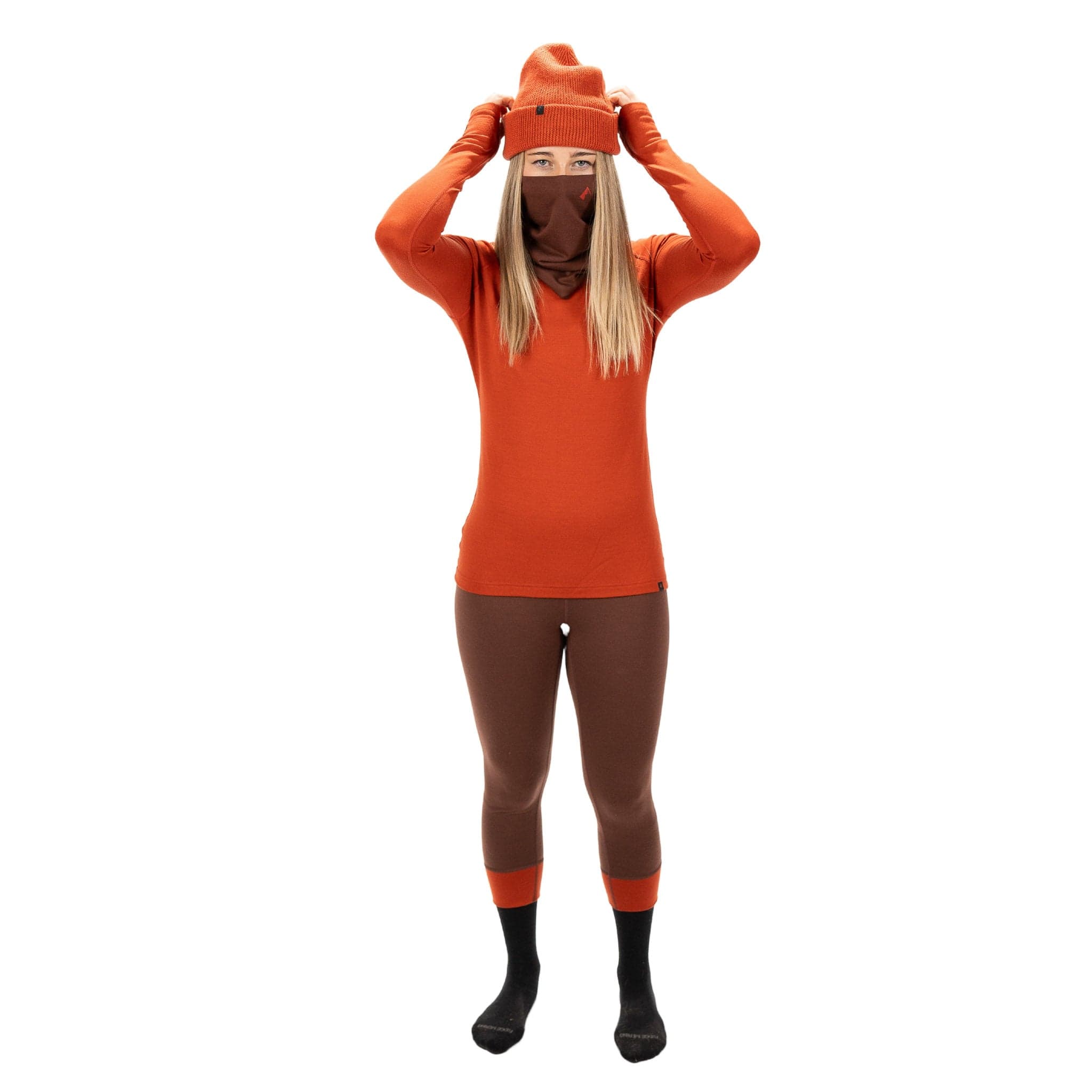 a model wearing a Ridge Merino neck gaiter and Ridge Merino base layers
