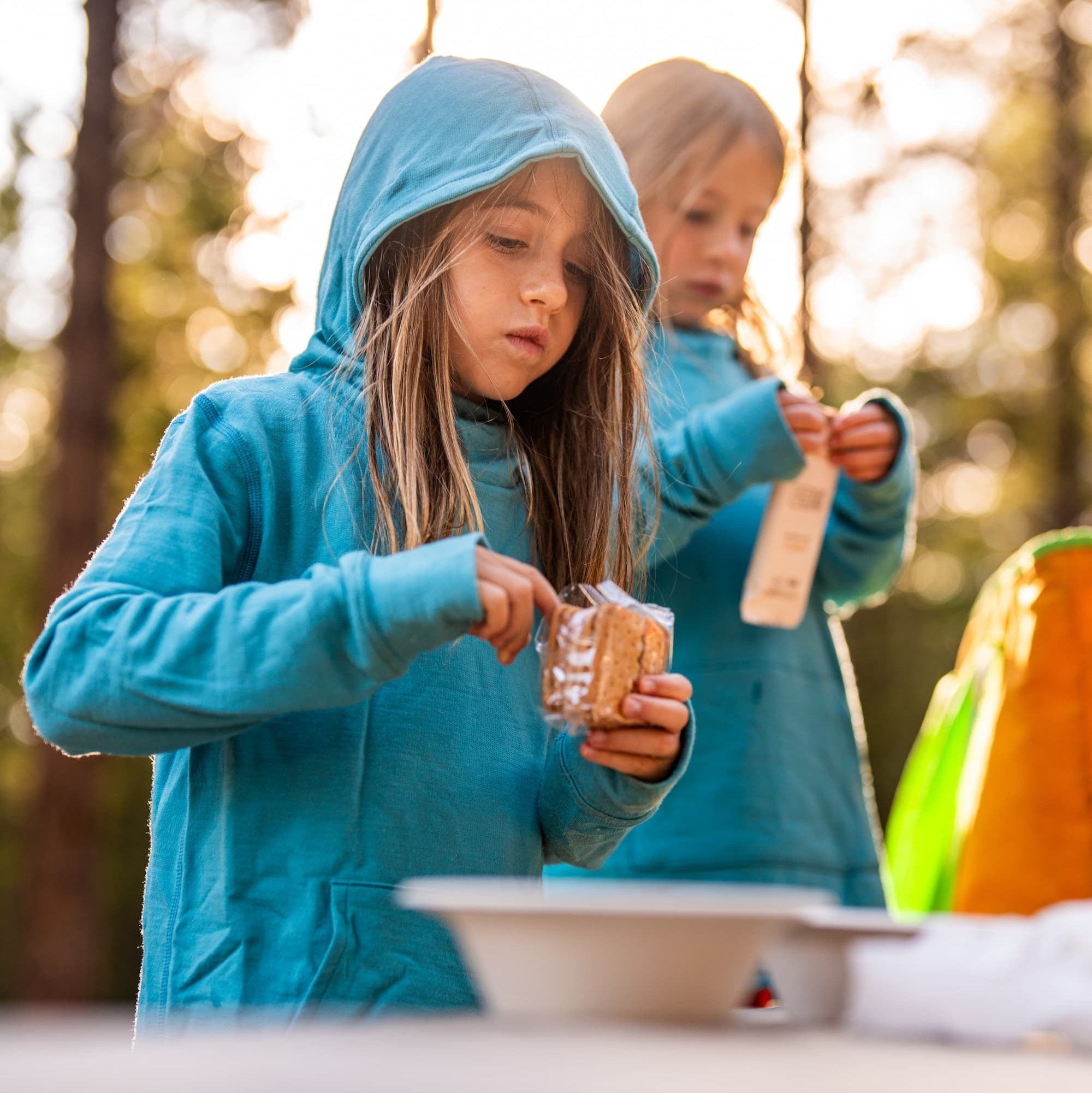 girls wearing Ridge Hyde Merino Hoodies at camp