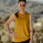 a woman wearing a Natural Tencel Merino Wool Tank Top in Goldenrod