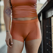 a woman wearing Ridge Merino Wool Boy Shorts in a previous year's color with a matching Merino wool bralette
