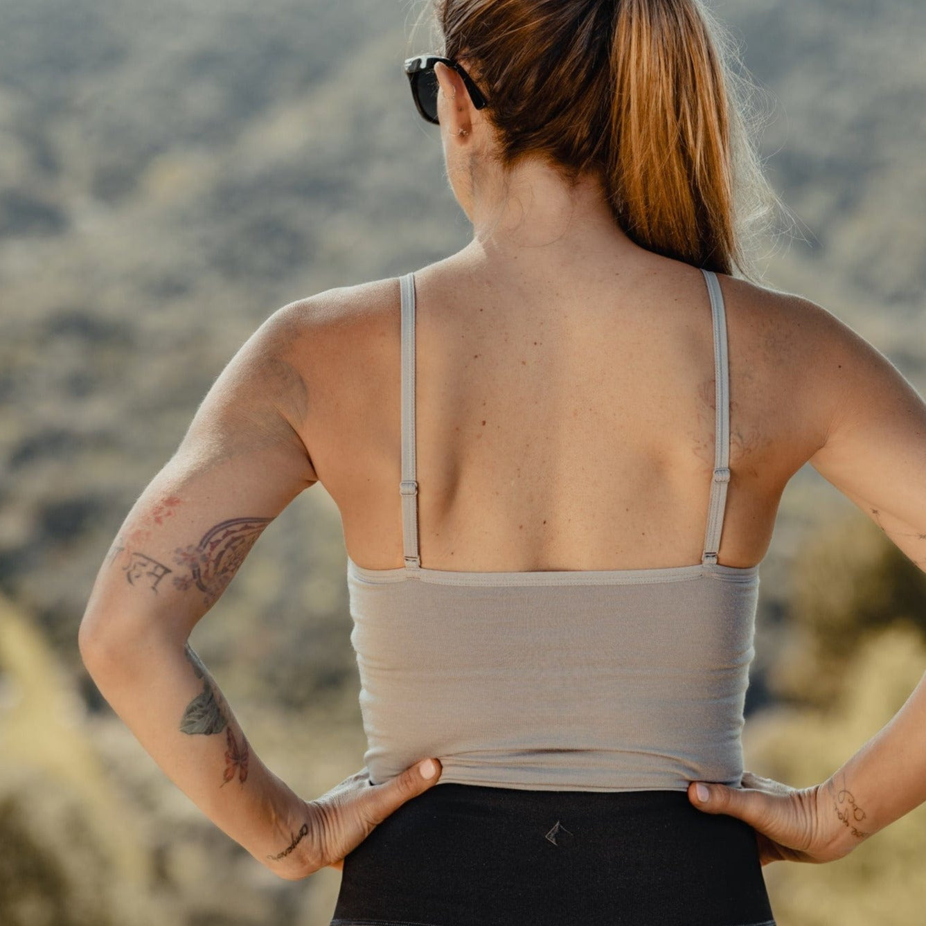 a woman wearing a Ridge Merino Bralette and Hilltop Shorts from the back