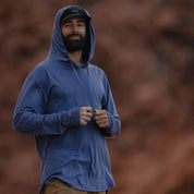 a man wearing a blue Ridge Solstice Sun Hoodie
