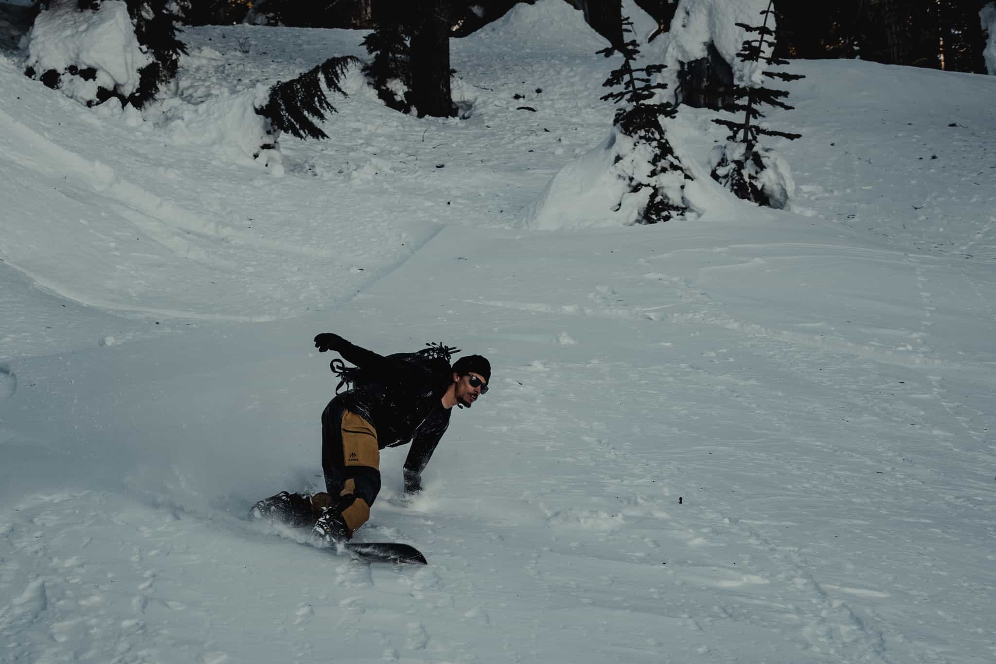 a man snowboarding in Ridge Merino layers