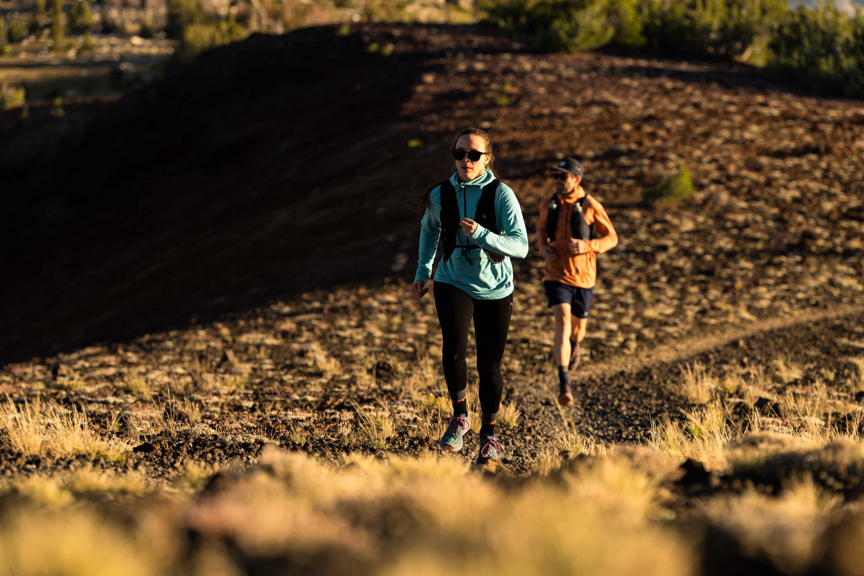 two people on a morning trail run in Mammoth Lakes wearing Ridge Convict Canyon Hoodies and Crowley Tights