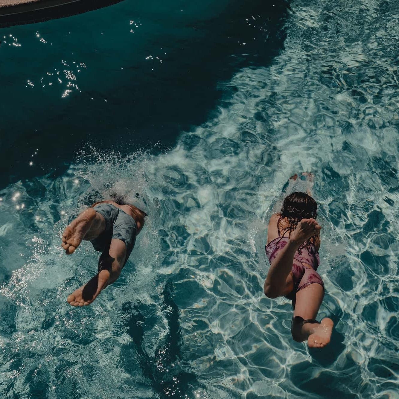 two people dive into a pool wearing Ridge Merino Wool Underwear