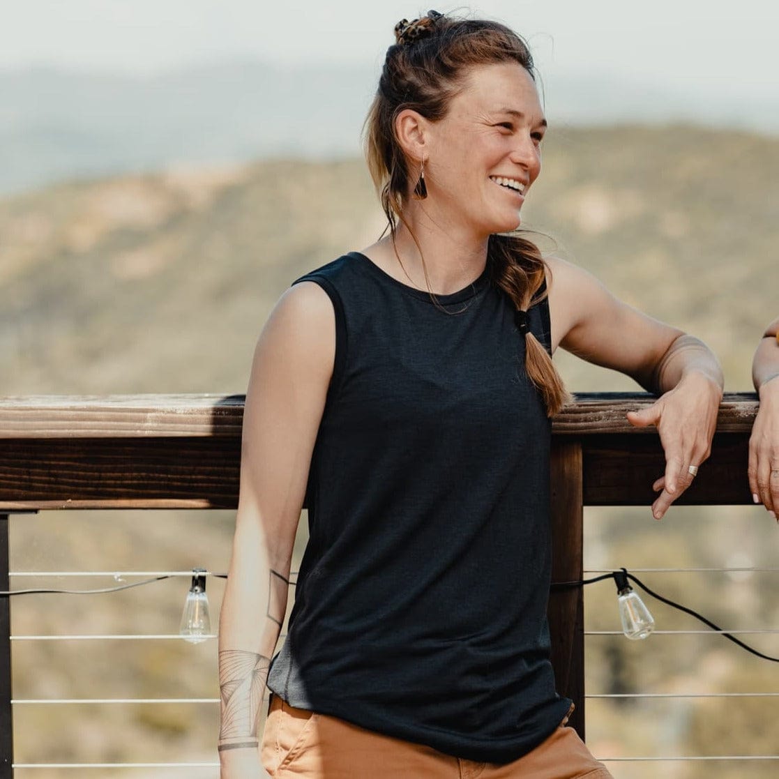 a woman laughing wearing a Natural Tencel Merino Wool Tank Top