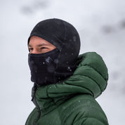 a man wearing a Ridge Merino Cloudripper Grid Fleece Balaclava