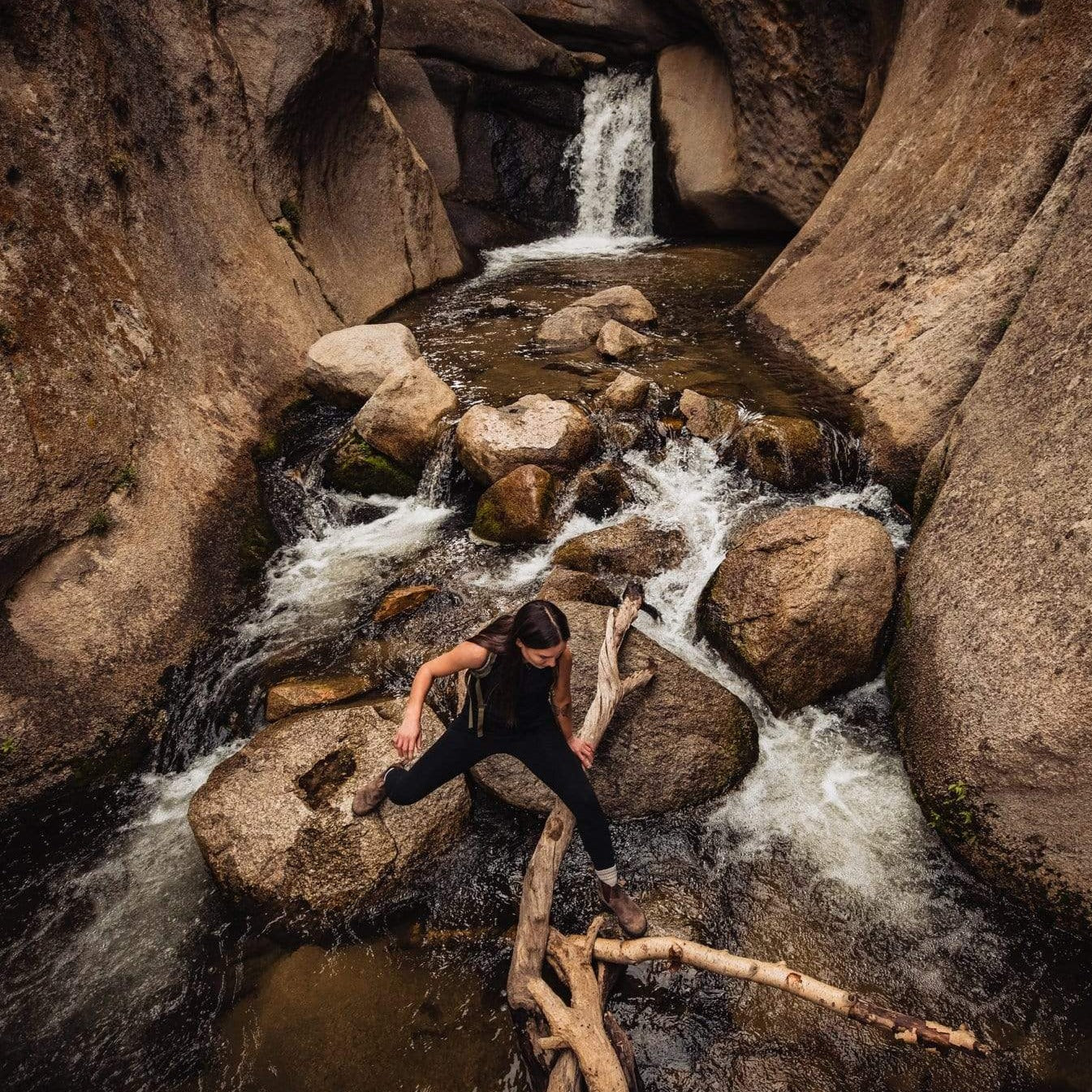 a woman hiking wearing a Natural Tencel Merino Wool Tank Top