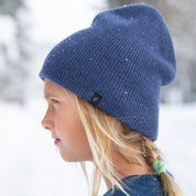 a girl wearing a Kids' Layton Merino Wool Beanie in the snow