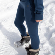 a girl wearing Ridge Inversion Base Layers in the snow