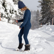 a girl wearing Ridge Kids' Inversion Base Layers in the snow
