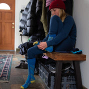 a girl getting ready to play in the snow in Ridge Kids' Inversion Base Layers