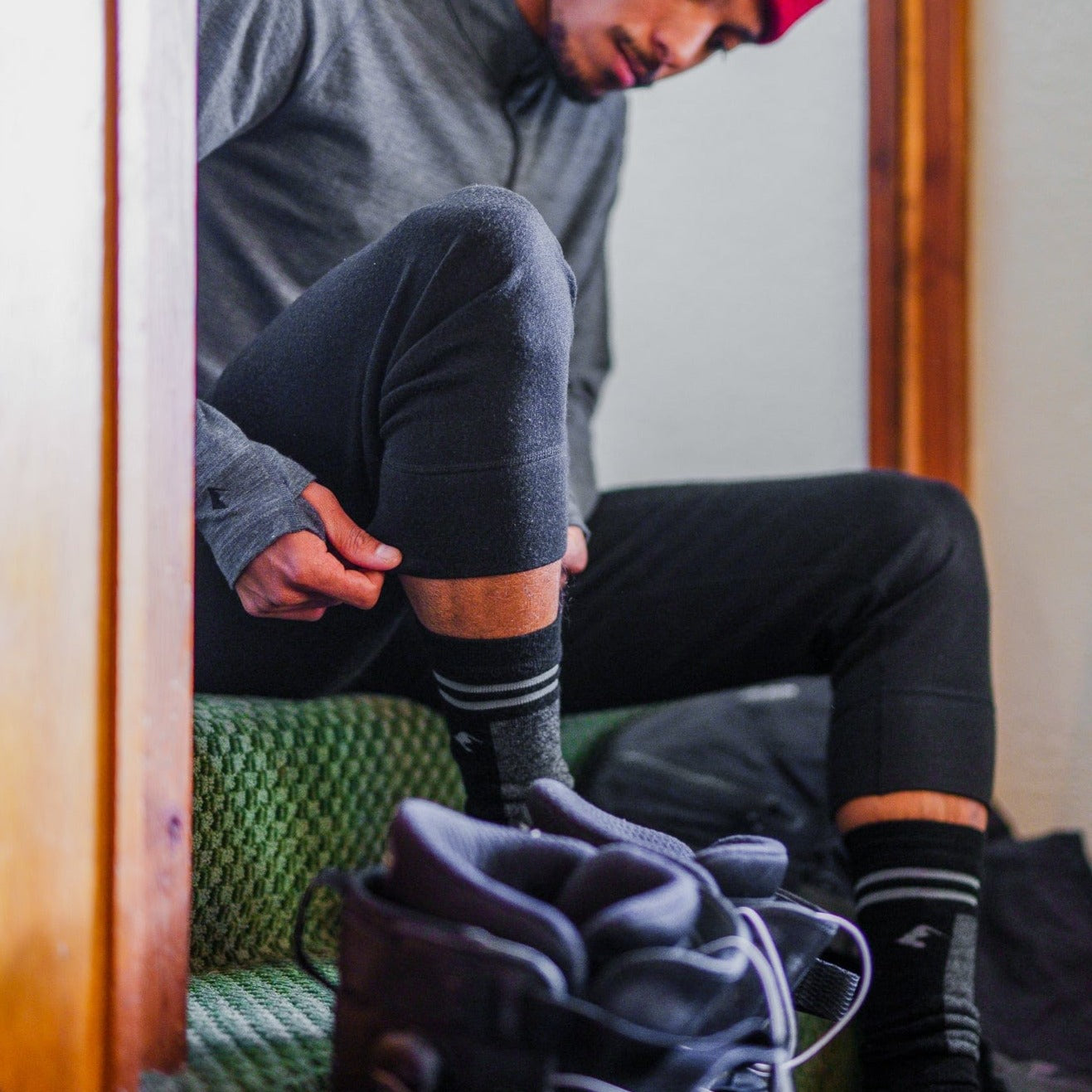 a skier gets ready for a ski day wearing Banked Merino Wool Ski Socks