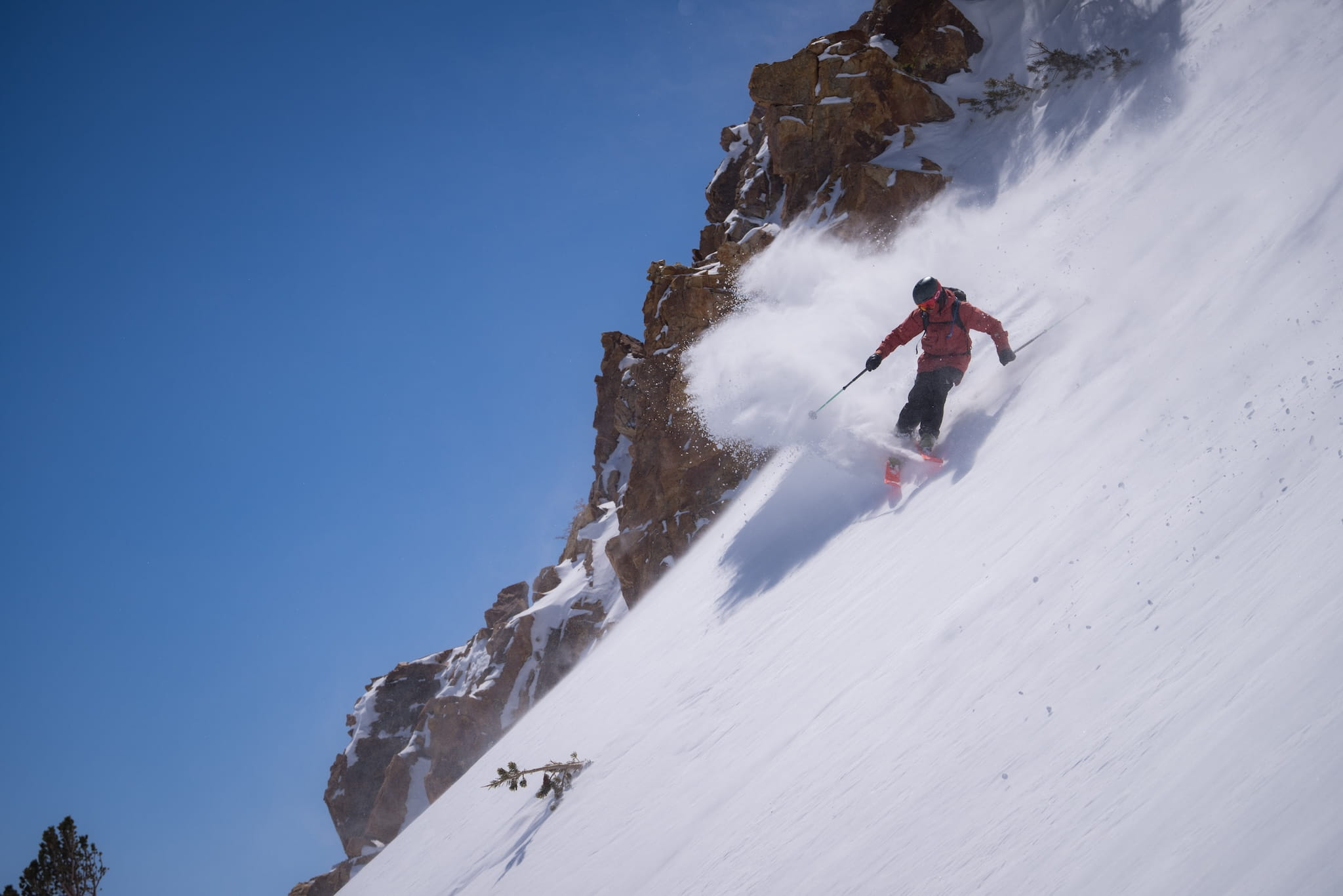 a skier cruising down a backcountry ski run