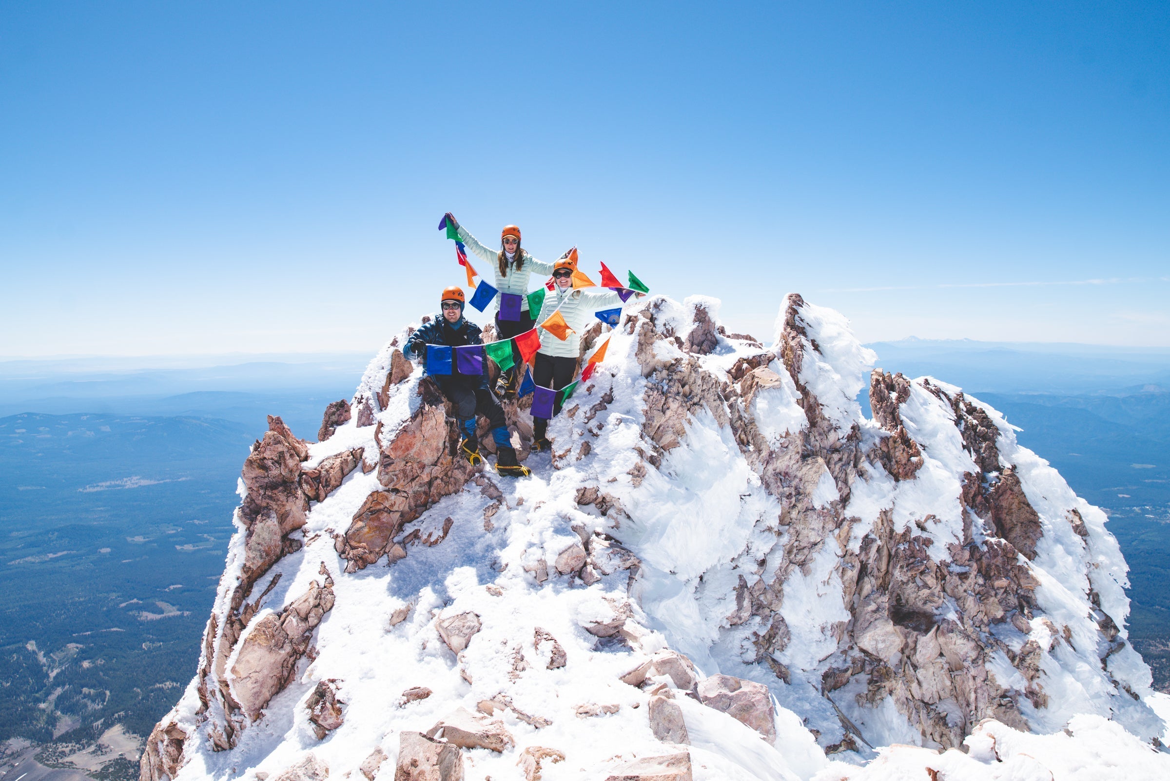 BCPP Climb Against the Odds climbers at the summit of Mt. Shasta with their prayer flags