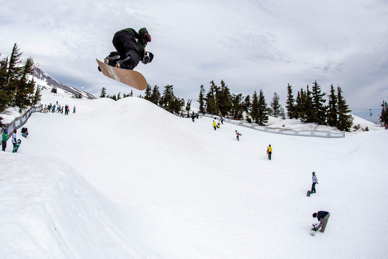 a snowboarder getting air at a ski resort