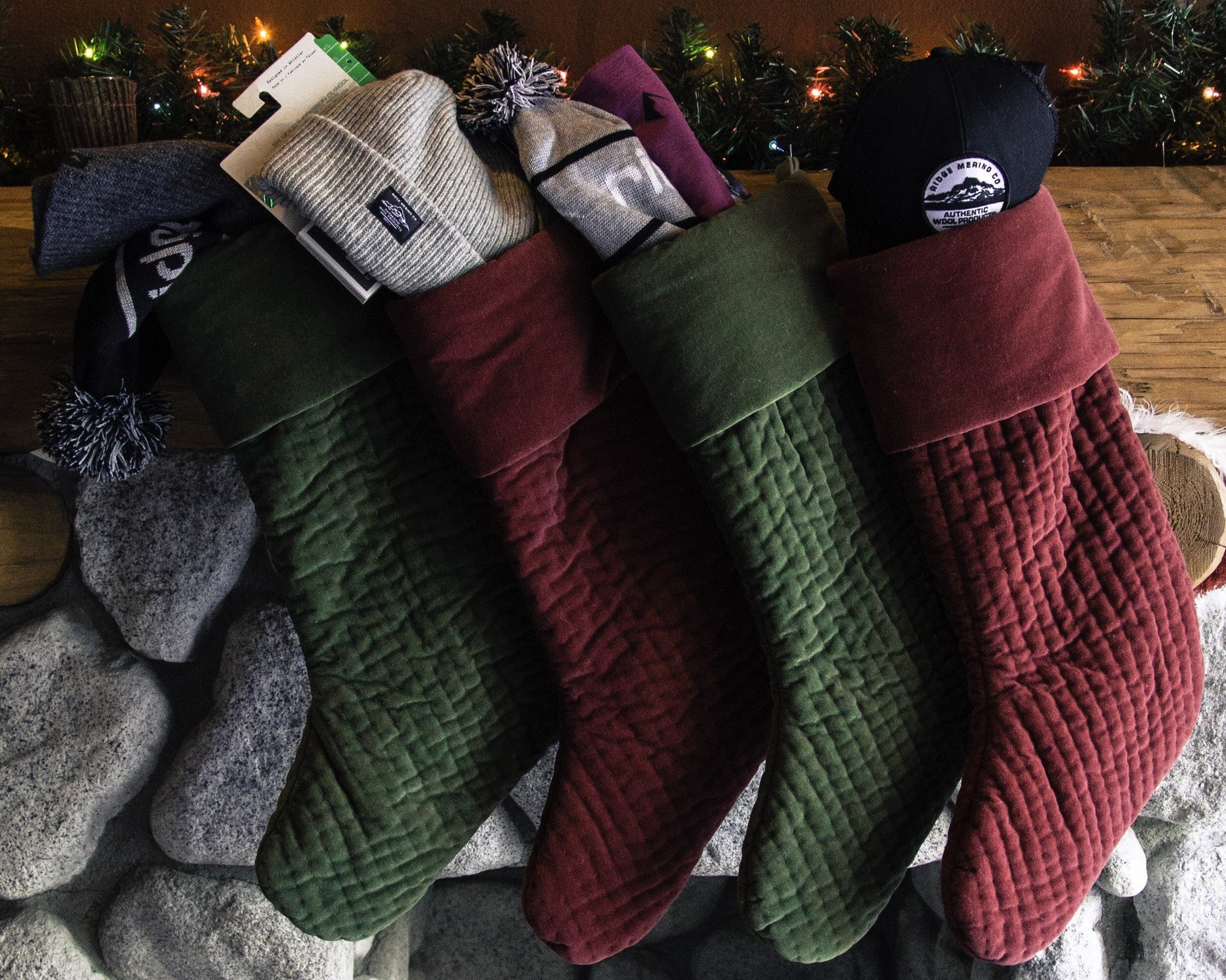 Ridge Merino accessories stuffed in stockings on a mantle