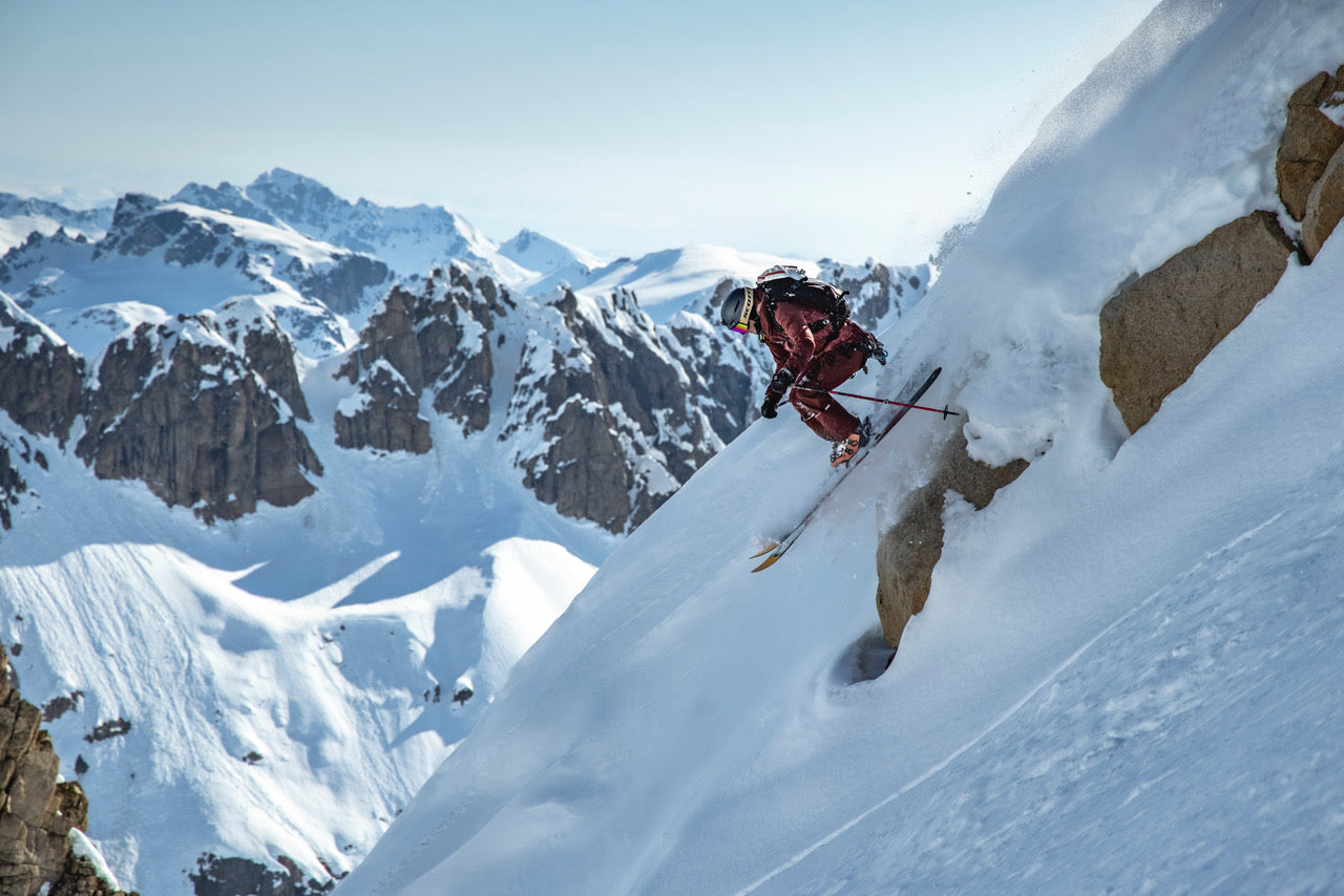 a skier gets air in the mountains