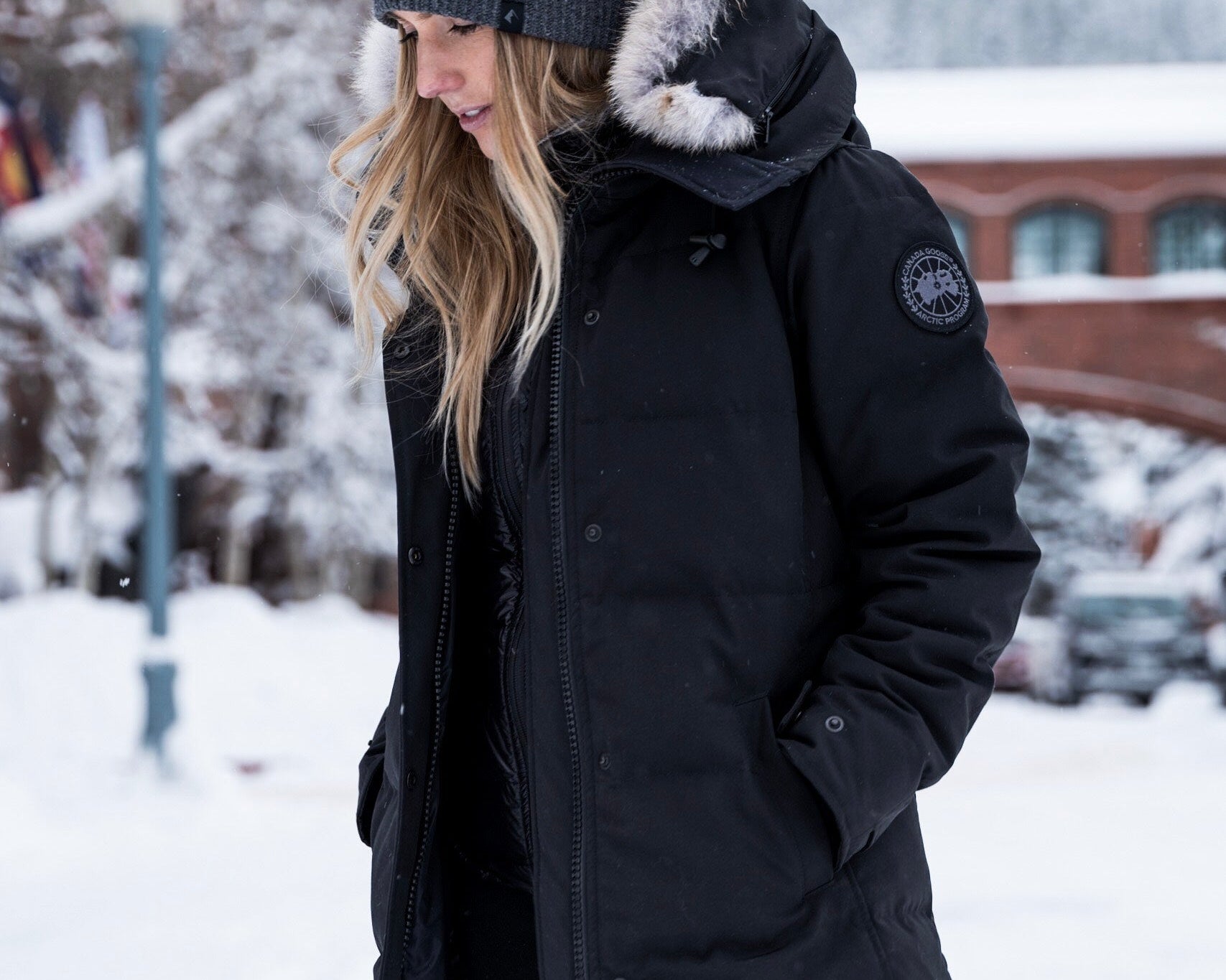 a woman wearing a Ridge beanie and a ski coat