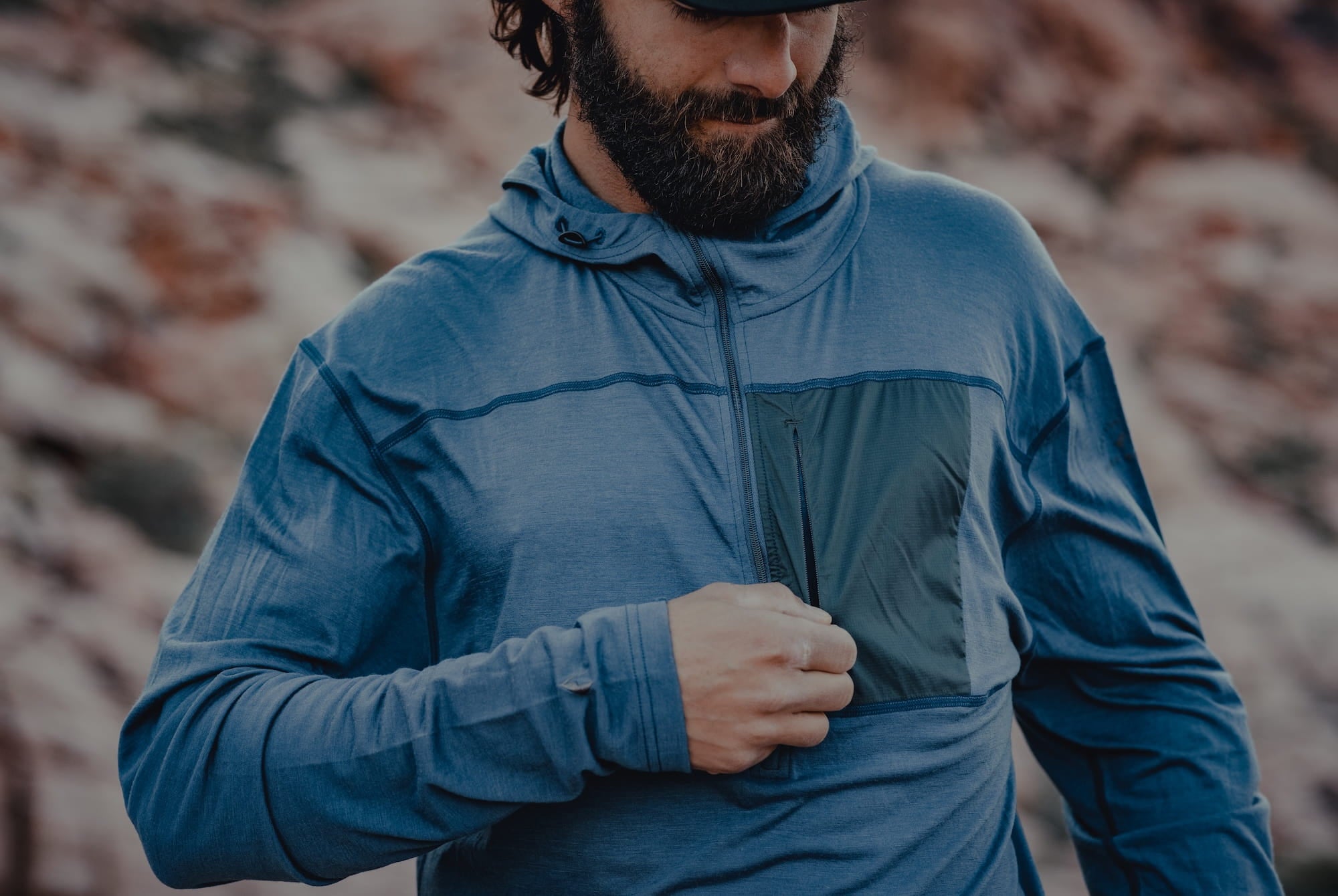 a closeup of the zipper on a blue Solstice Sun Hoodie