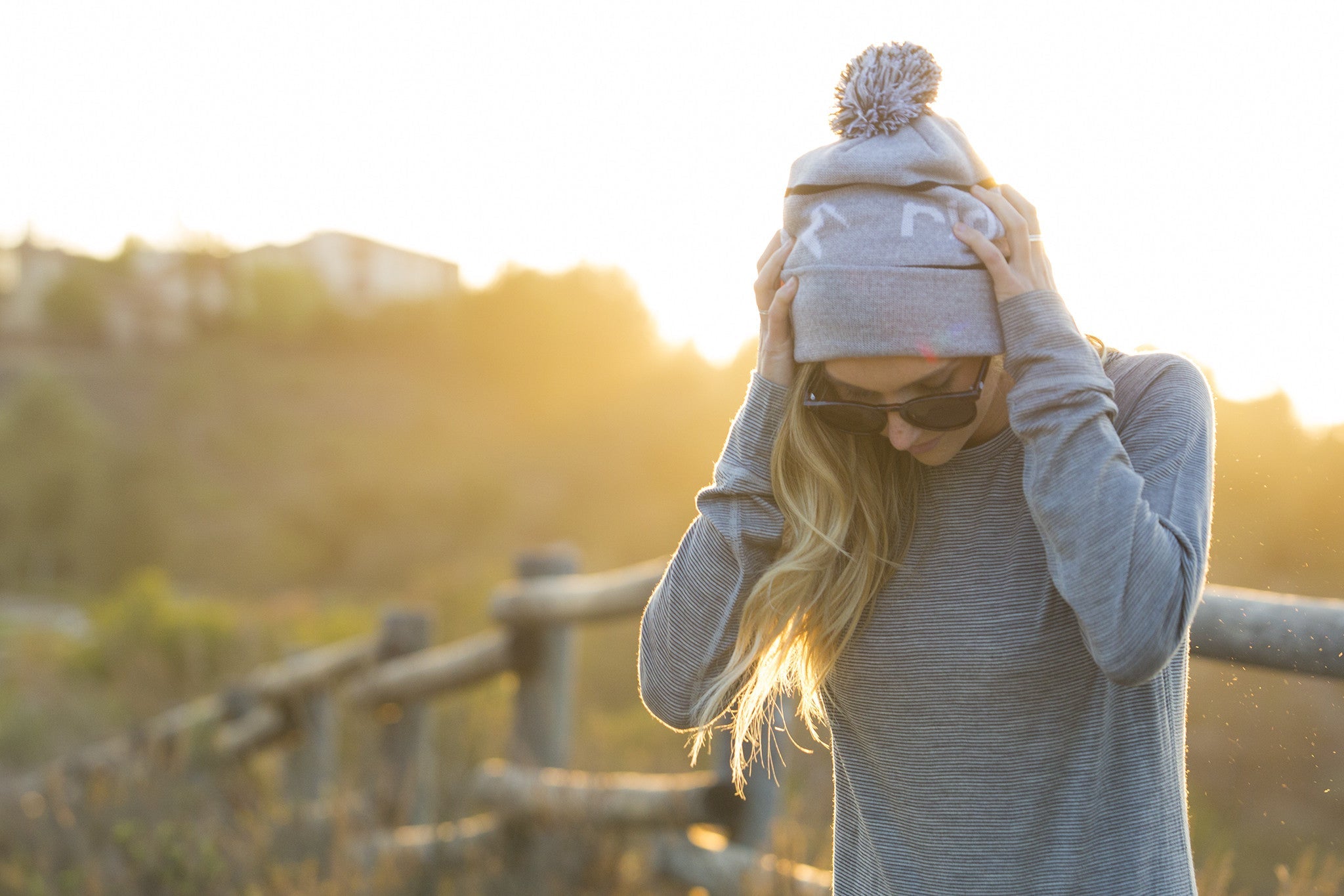 a hiker wearing a base layer top with a Ridge Merino beanie