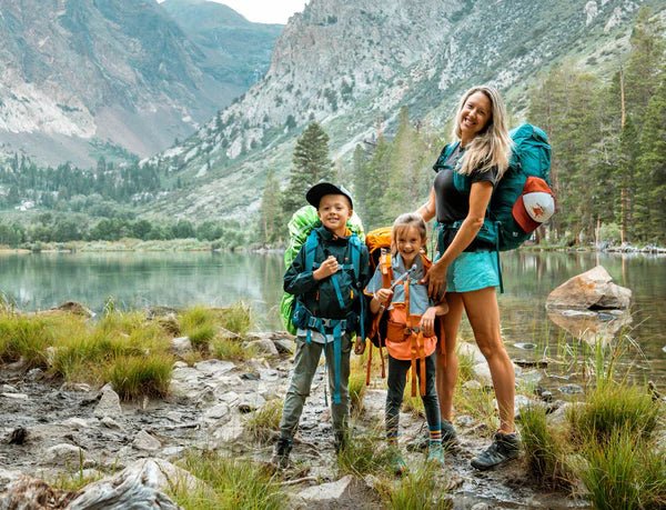 a mom on a backpacking trip with her two kids