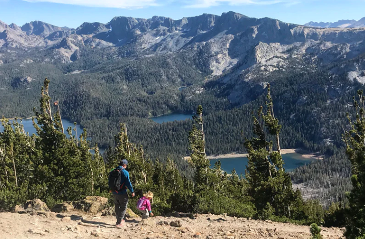 a dad following his child while out hiking in Mammoth Lakes, CA