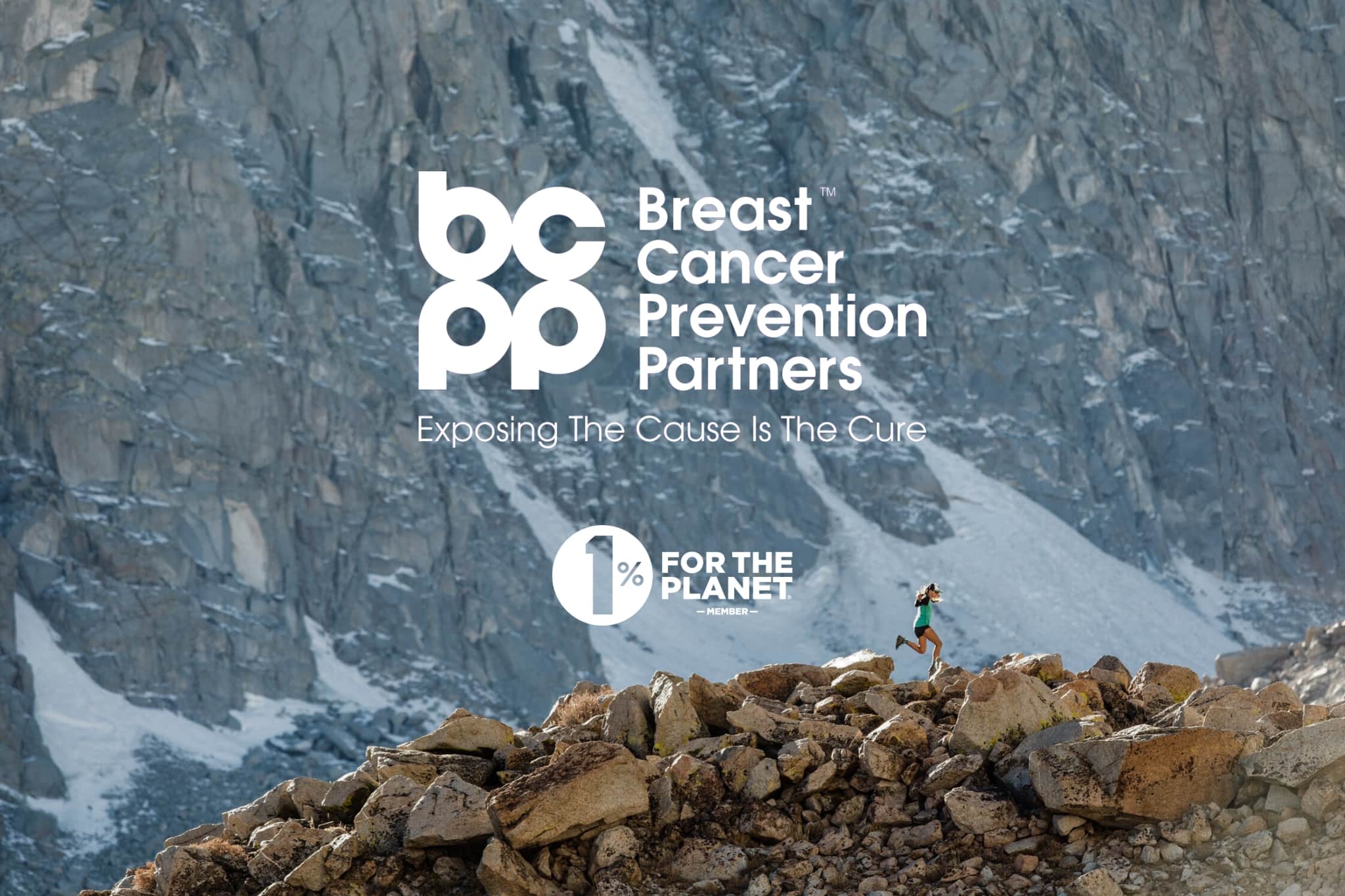 a runner in the mountains with the Breast Cancer Prevention Partners and 1% For The Planet logos over it
