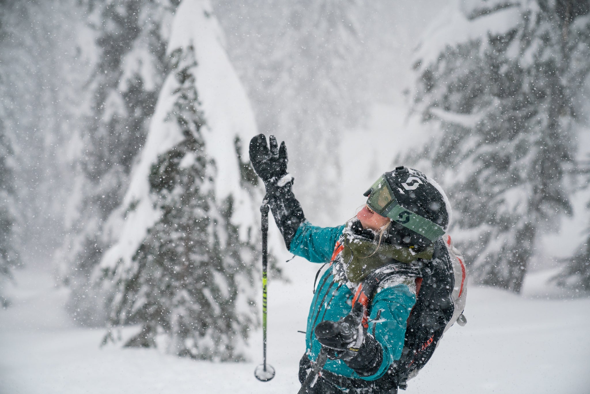 a skier praising the snowfall