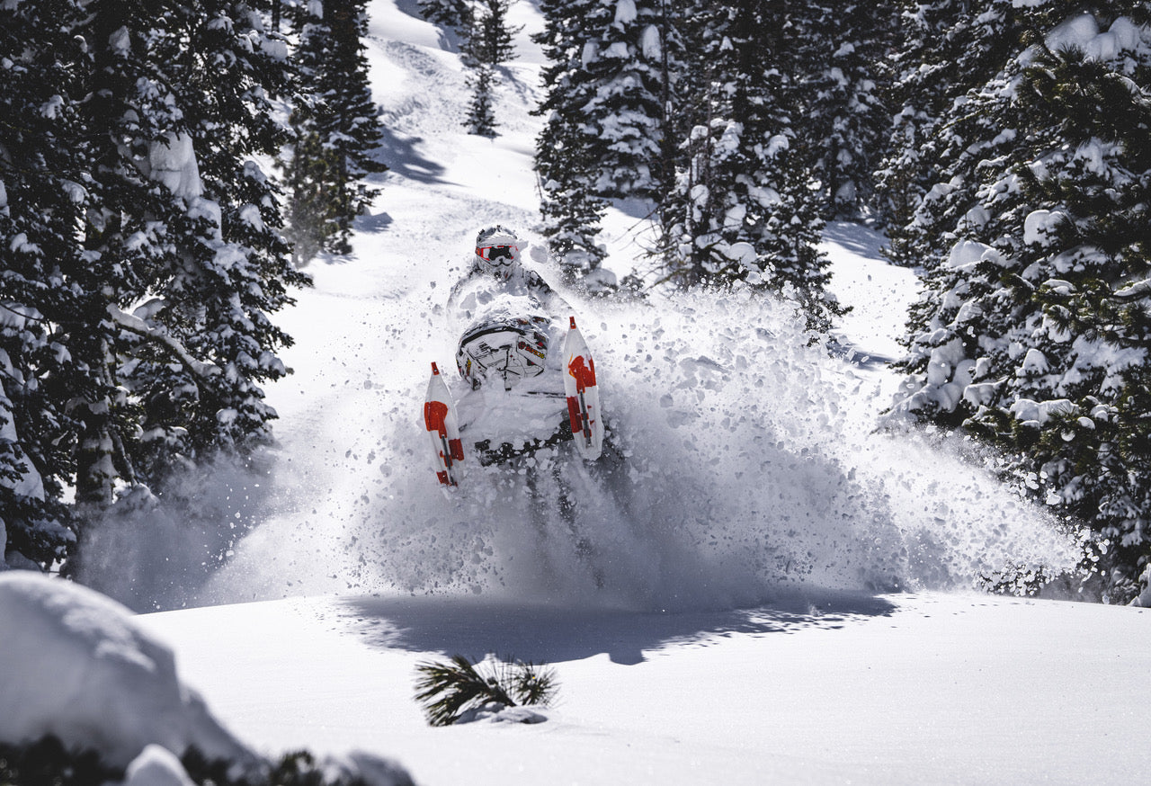 Amie Engerbretson shredding on a snowmobile