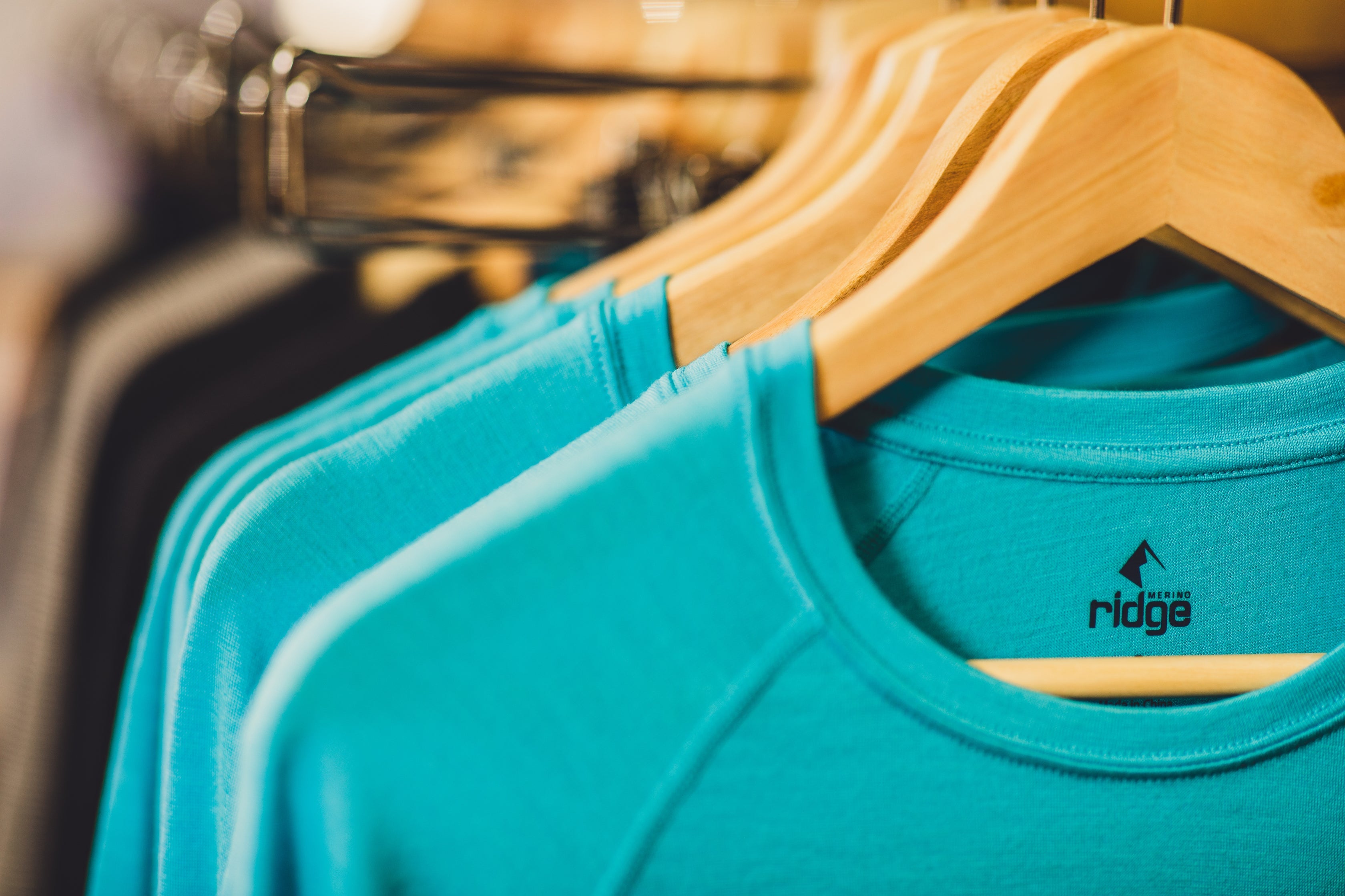 Ridge Merino base layers hanging up in Ridge's storefront in Mammoth Lakes