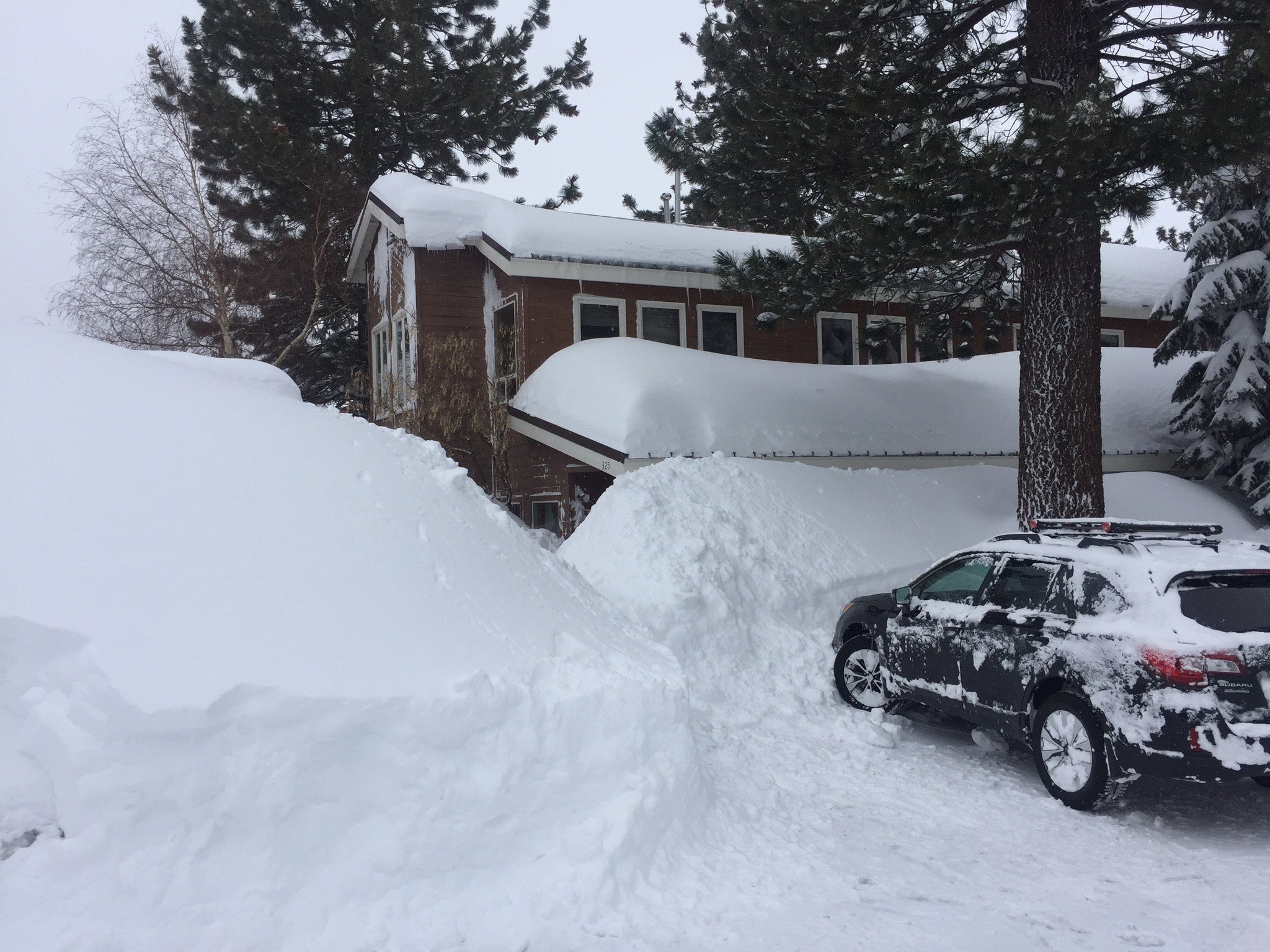 snow so deep in Mammoth Lakes you can hardly see the entrance to Ridge Merino's office