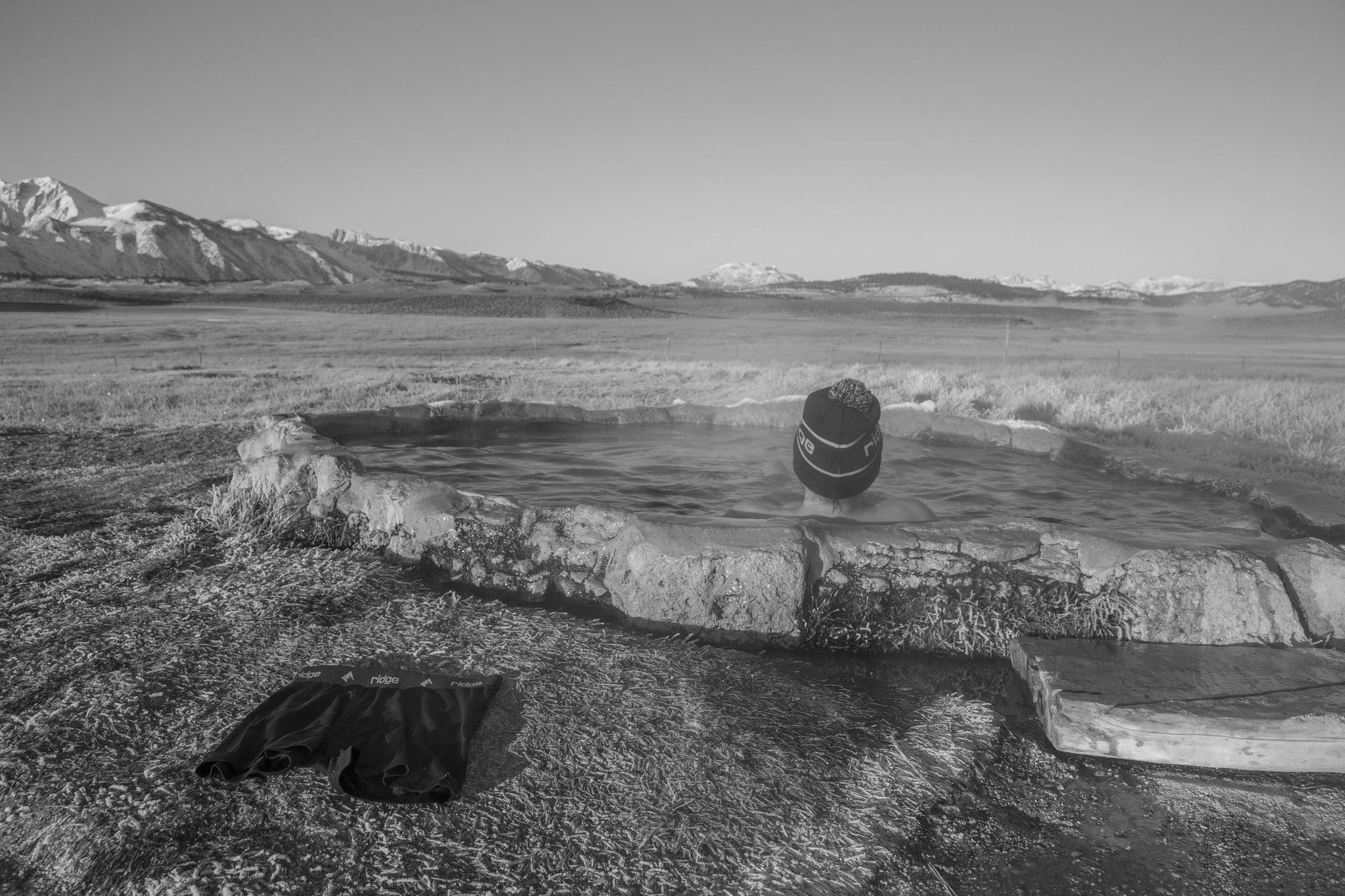 a man soaking in a hot spring in Mammoth Lakes