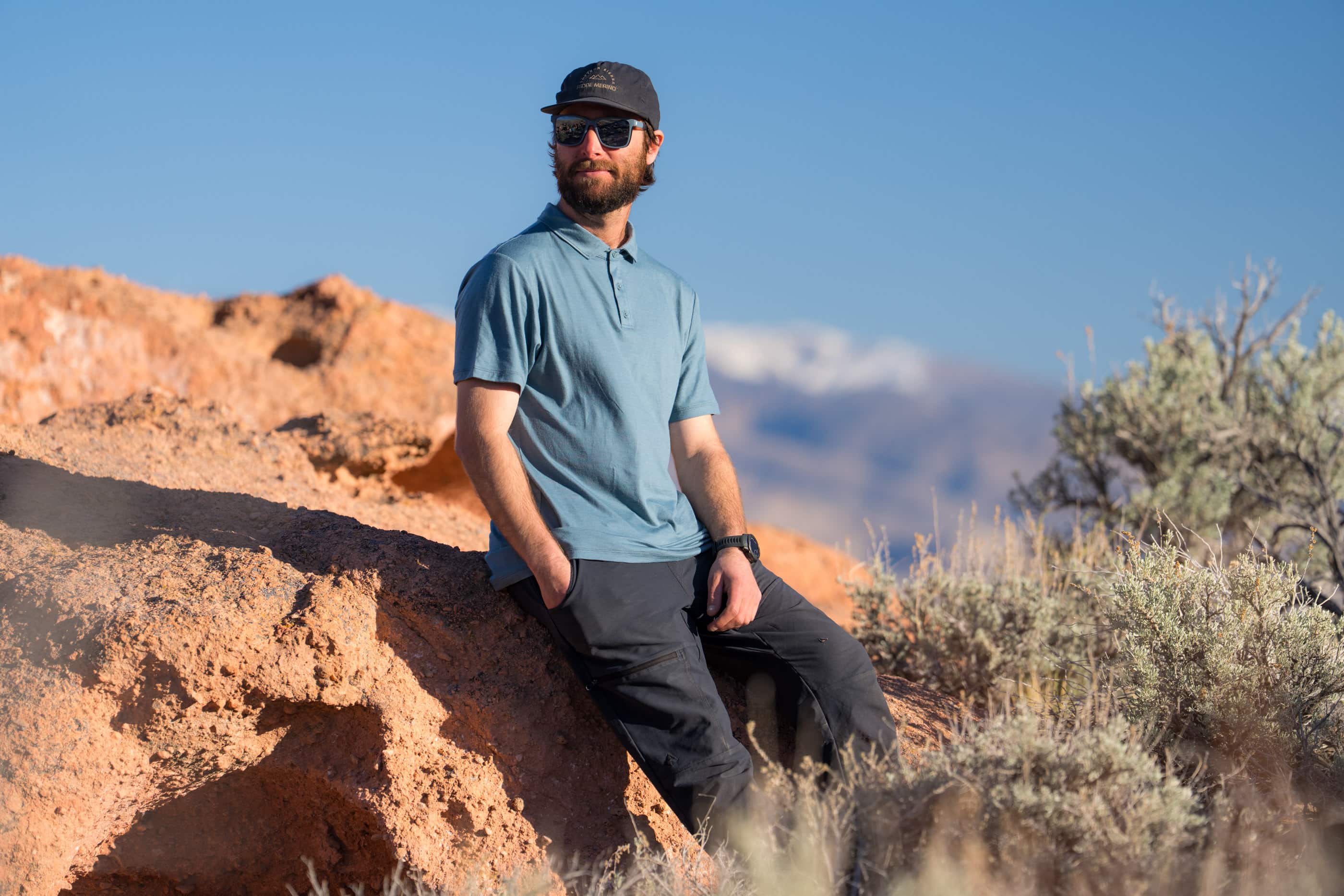 a man wearing a blue Ridge Merino Polo Shirt