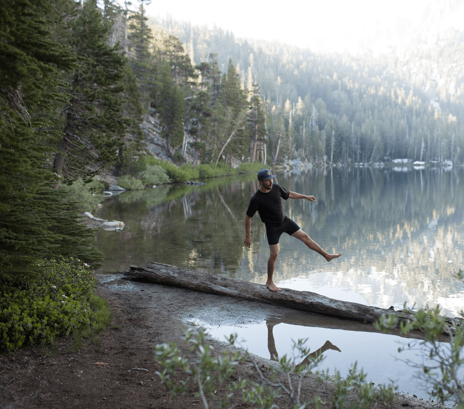 a man walking along a log wearing a Ridge t-shirt and Ridge Merino Boxer Briefs
