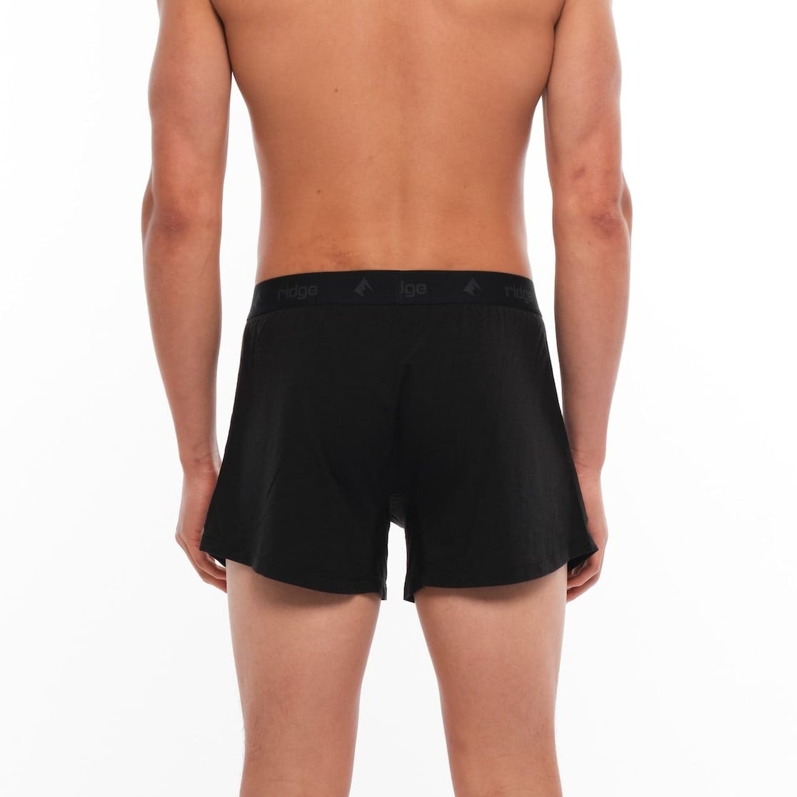 a man wearing black Ridge Merino Boxer Shorts from the back