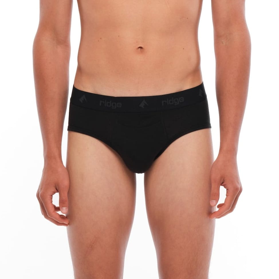 a man wearing black Merino wool briefs