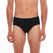 a man wearing black Merino wool briefs