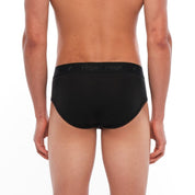 a man wearing black Merino wool briefs
