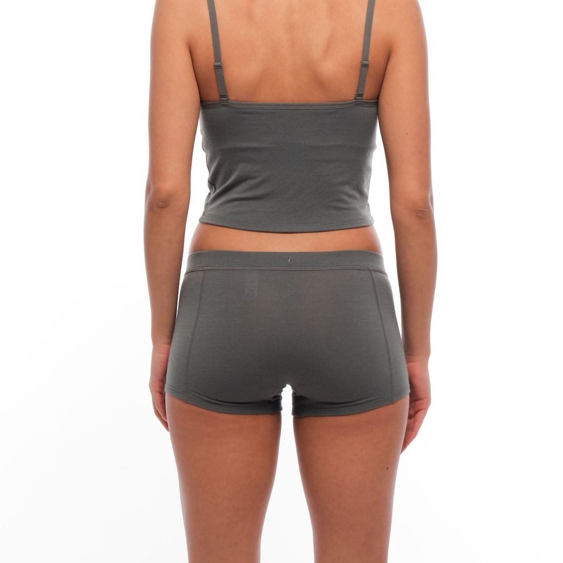 a woman wearing Gunmetal Boy Shorts with a matching bralette from the back