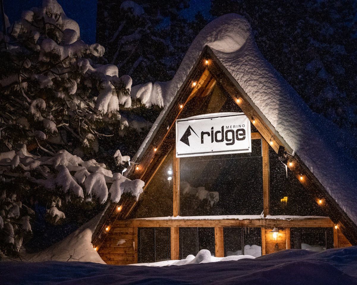 Ridge Collective lit up at night covered in snow