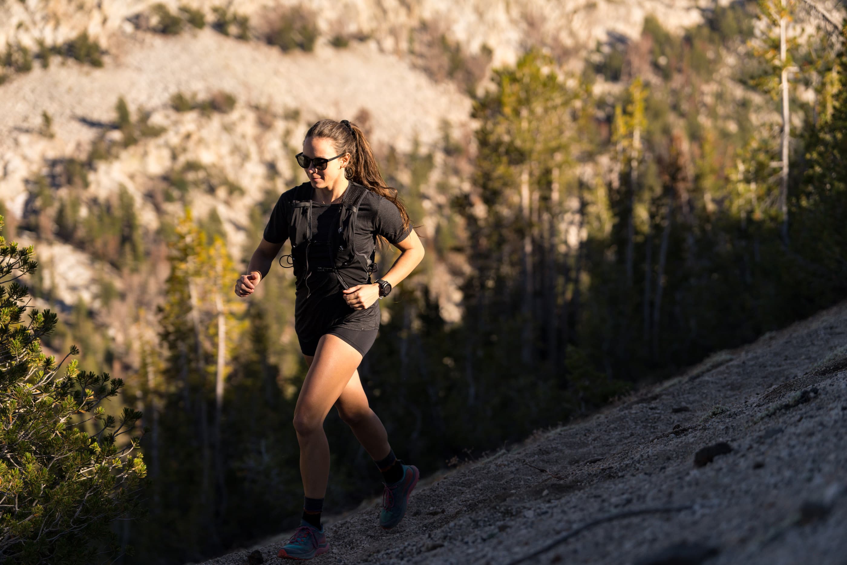 a woman on a trail run in Mammoth Lakes wearing a Pursuit Ultralight Tee